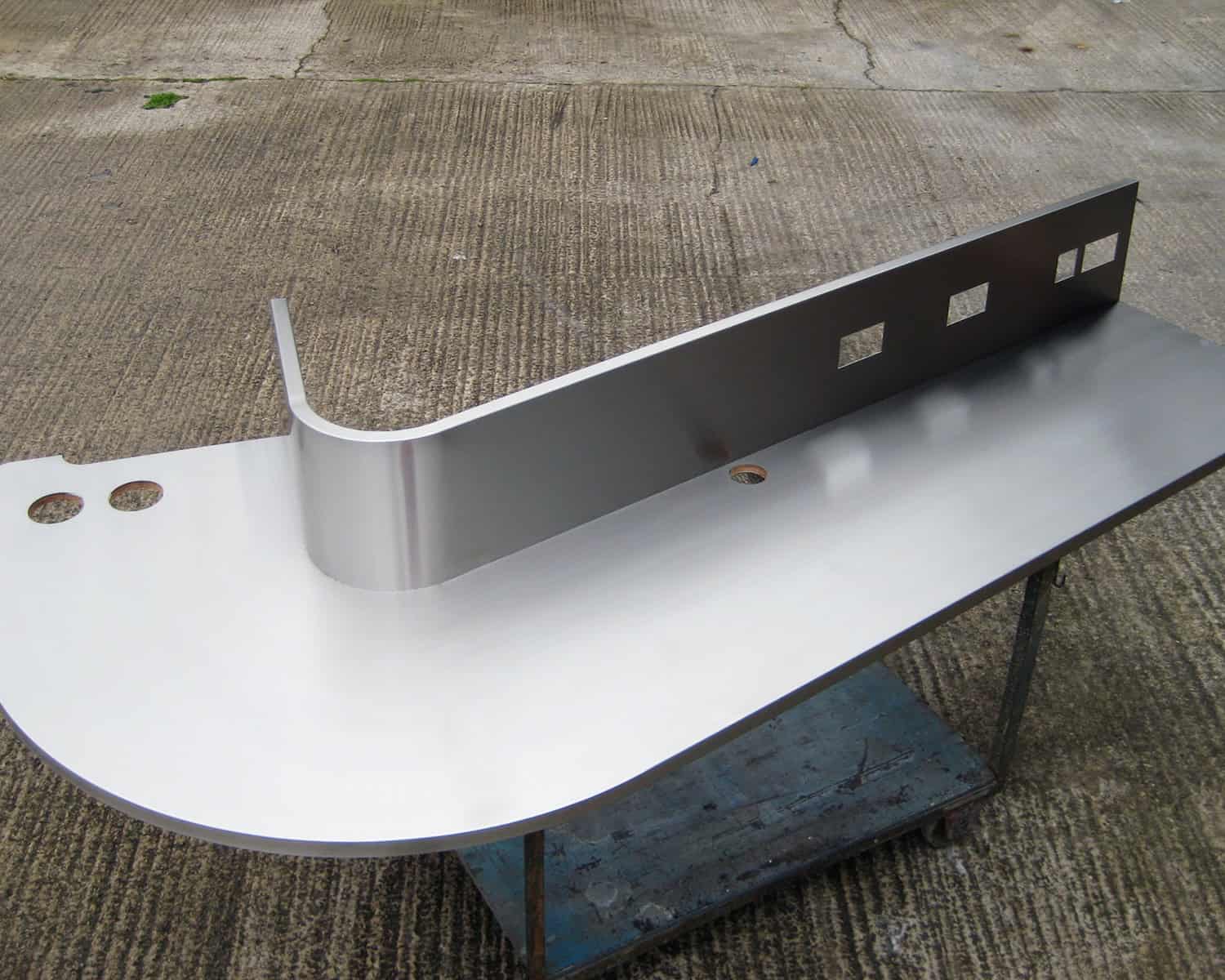 Stainless steel worktop with curved edge by Knaresborough Engineering (Yorkshire) Limited. Stainless steel worktop with curved edge by Knaresborough Engineering (Yorkshire) Limited.